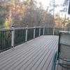 Mulit level custom deck with borders and dividers. Also includes detailed metal railing system with glass post caps.